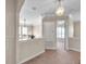 Well-lit hallway with neutral walls, carpeting, and access to bedrooms at 18014 Cozumel Isle Dr, Tampa, FL 33647