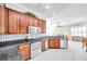 Kitchen with stainless steel appliances and dark wood cabinets at 18014 Cozumel Isle Dr, Tampa, FL 33647