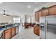Kitchen with stainless steel appliances and dark wood cabinets at 18014 Cozumel Isle Dr, Tampa, FL 33647