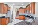 Kitchen with stainless steel appliances and dark wood cabinets at 18014 Cozumel Isle Dr, Tampa, FL 33647