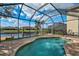 Screened pool and patio with a view of the canal at 18014 Cozumel Isle Dr, Tampa, FL 33647