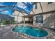 Refreshing kidney-shaped pool with screened enclosure at 18014 Cozumel Isle Dr, Tampa, FL 33647