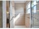 Spacious walk-in shower with grab bars and tiled walls at 18014 Cozumel Isle Dr, Tampa, FL 33647