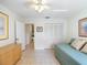 Bright guest bedroom with tiled floors and built-in closet at 207 Lighthouse Ct, Safety Harbor, FL 34695