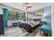Spacious bedroom with large windows and teal accents at 215 Woods Landing Trl, Oldsmar, FL 34677