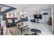 Open concept living room with access to kitchen and patio at 215 Woods Landing Trl, Oldsmar, FL 34677