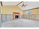 Living room with vaulted ceiling and fireplace, currently under renovation at 2416 16Th W St, Palmetto, FL 34221