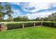 Green grassy backyard with a view of a golf course at 2817 Roehampton Close, Tarpon Springs, FL 34688