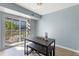 Dining area with table and bench, slider to balcony at 3315 58Th S Ave # 210, St Petersburg, FL 33712
