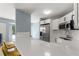 Modern kitchen with white cabinets and breakfast bar at 3315 58Th S Ave # 210, St Petersburg, FL 33712