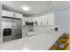 Updated kitchen with white cabinets and quartz countertops at 3315 58Th S Ave # 210, St Petersburg, FL 33712