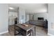 Open concept kitchen with white cabinets, and breakfast bar at 3315 58Th S Ave # 210, St Petersburg, FL 33712