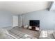 Bright living room with comfy couches and a large TV at 3315 58Th S Ave # 210, St Petersburg, FL 33712