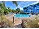 Refreshing circular pool surrounded by tropical landscaping at 3315 58Th S Ave # 210, St Petersburg, FL 33712