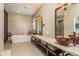 Elegant bathroom with double vanity, soaking tub, and walk-in shower at 3337 Crescent Oaks Blvd, Tarpon Springs, FL 34688