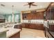 Kitchen boasts ample cabinetry and granite countertops at 3337 Crescent Oaks Blvd, Tarpon Springs, FL 34688