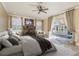 Serene main bedroom with a view of the pool, a decorative fireplace, and elegant curtains at 3337 Crescent Oaks Blvd, Tarpon Springs, FL 34688