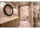 Spa-like bathroom with a marble vanity and walk-in shower at 4518 W Rosemere Rd, Tampa, FL 33609