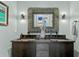 Elegant bathroom features a double vanity with unique mirror and modern fixtures at 4518 W Rosemere Rd, Tampa, FL 33609