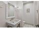 Elegant bathroom with a marble sink, decorative mirror, modern fixtures, and tiled floor at 4518 W Rosemere Rd, Tampa, FL 33609