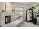 Bright room featuring a fireplace and unique chaise lounge near a window at 4518 W Rosemere Rd, Tampa, FL 33609