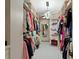 Spacious walk-in closet with custom shelving and organized storage, providing ample space for clothing and accessories at 4518 W Rosemere Rd, Tampa, FL 33609