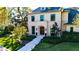 Stately home with lush landscaping, a welcoming entrance, and a well-manicured lawn at 4518 W Rosemere Rd, Tampa, FL 33609