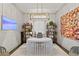 Comfortable home office with custom desk, stylish light fixture, and modern decor at 4518 W Rosemere Rd, Tampa, FL 33609