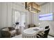 Comfortable home office with custom desk, stylish light fixture, and modern decor at 4518 W Rosemere Rd, Tampa, FL 33609