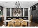 Gourmet kitchen features a large island with seating, a dining table, and modern lighting at 4518 W Rosemere Rd, Tampa, FL 33609