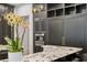 Modern kitchen features custom cabinets, stainless steel appliances and a spacious island with granite countertops at 4518 W Rosemere Rd, Tampa, FL 33609