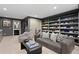 Stylish living room with gray walls, custom shoe shelving, and modern furniture at 4518 W Rosemere Rd, Tampa, FL 33609