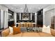 Open floor plan featuring a kitchen island and a living room with a sofa and accent pillows at 4518 W Rosemere Rd, Tampa, FL 33609