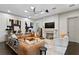 Bright living room featuring fireplace, stylish furniture, and contemporary art at 4518 W Rosemere Rd, Tampa, FL 33609