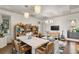 Bright room with a dining table, bookshelves, and stylish decor under elegant lighting at 4518 W Rosemere Rd, Tampa, FL 33609