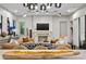 Stylish living room with a fireplace, comfortable seating, and modern lighting fixtures at 4518 W Rosemere Rd, Tampa, FL 33609