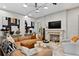 Cozy living room featuring a fireplace, comfortable seating, and modern decor at 4518 W Rosemere Rd, Tampa, FL 33609
