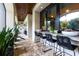 Charming outdoor bar area with marble countertop, bar stools, and views, ideal for entertaining guests at 4518 W Rosemere Rd, Tampa, FL 33609