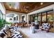 Spacious outdoor patio with elegant seating, dining area, and lush greenery, creating a perfect entertaining space at 4518 W Rosemere Rd, Tampa, FL 33609