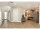 Bright entryway with wood-look tile floors and a view of the staircase at 4587 Almada Ln, Wesley Chapel, FL 33543