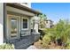 Front porch with a bench, stone columns, and landscaping at 4587 Almada Ln, Wesley Chapel, FL 33543