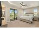 Spacious main bedroom with private balcony access and neutral decor at 4587 Almada Ln, Wesley Chapel, FL 33543