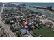 Waterfront property with easy access to the Gulf, a private dock, and a stunning aerial view of the neighborhood at 505 80Th Ave, St Pete Beach, FL 33706