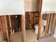 Bathroom with a standard toilet and some exposed framing in need of remodeling at 505 80Th Ave, St Pete Beach, FL 33706