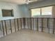 Bedroom with vintage light fixtures and large windows offering plenty of natural light at 505 80Th Ave, St Pete Beach, FL 33706