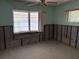 Bedroom with vintage light fixtures and large windows offering plenty of natural light at 505 80Th Ave, St Pete Beach, FL 33706