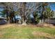 Classic home nestled among mature trees, offering a serene and private setting with established greenery at 505 80Th Ave, St Pete Beach, FL 33706