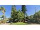 Charming home with mature trees, lush lawn, and well-maintained landscaping, creating inviting curb appeal at 505 80Th Ave, St Pete Beach, FL 33706