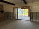 Open-concept living room with sliding glass doors that lead to the backyard and water access at 505 80Th Ave, St Pete Beach, FL 33706