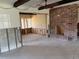 Open-concept living room with partial view into another room with natural lighting at 505 80Th Ave, St Pete Beach, FL 33706